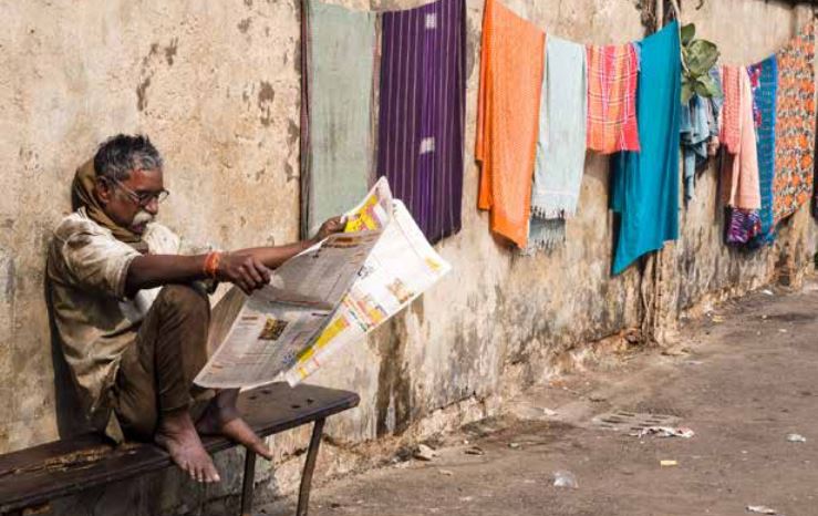 EJN_Ethics_in_the_News_man_Reading_Newspapers